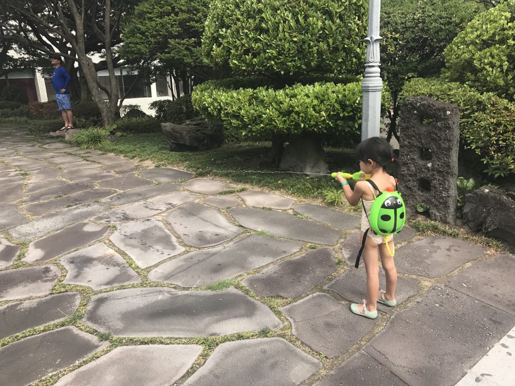 girl playing water gun