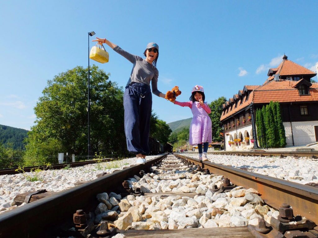 mum and daughter on train track