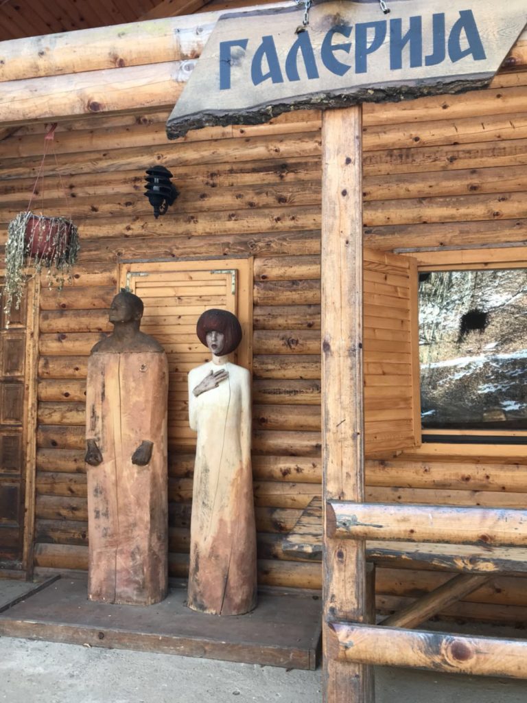 small sculptures in front of a shop