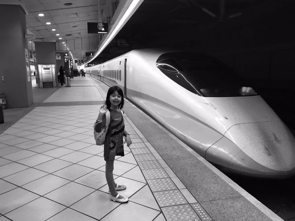 little girl by the high speed train